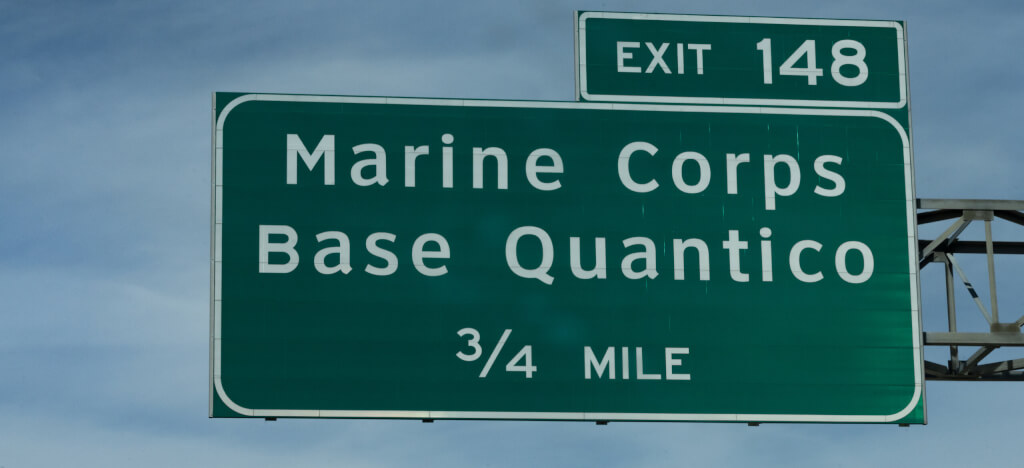 A highways sign leads drivers towards the US Marine Corps base in Quantico, VA.