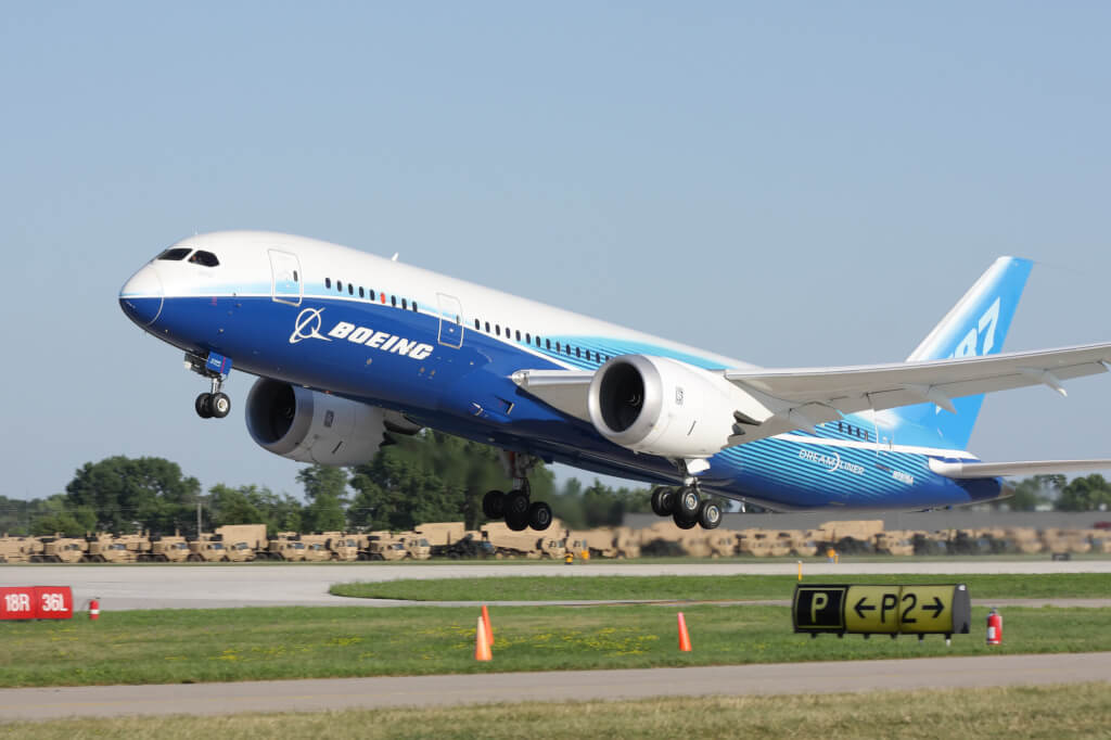 Brand new Boeing 787 Dreamliner in factory paint scheme taking off during EAA Airventure 2011.